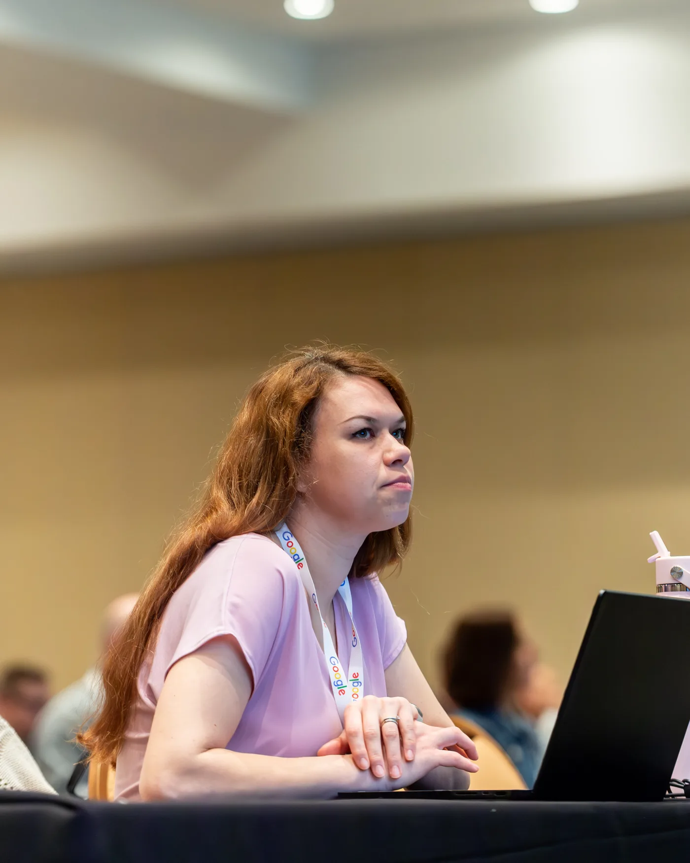 Attendee focused on a hands-on workshop at All Things AI 2026