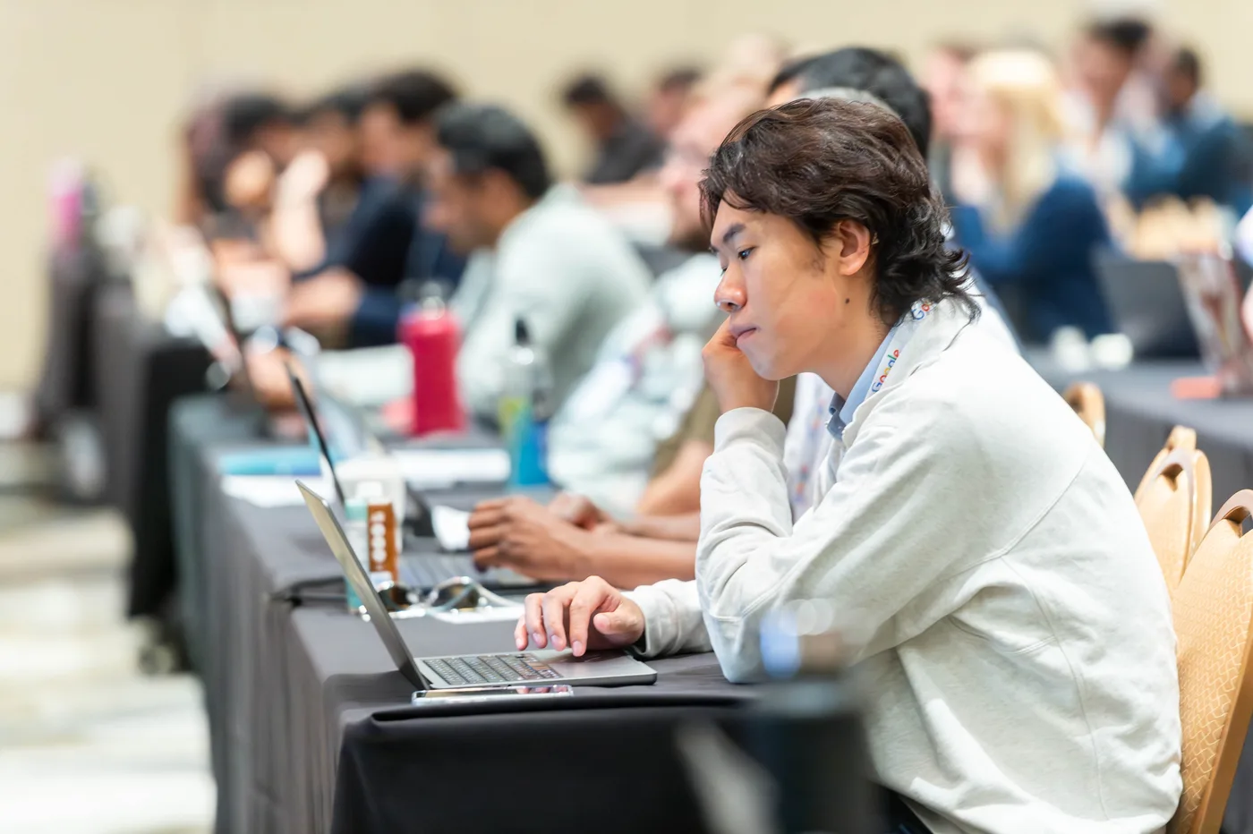 Attendees building on laptops at All Things AI 2026